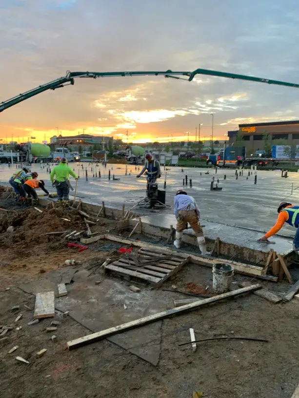 Cardona Brothers concrete crew working at sunset on professional foundation pour