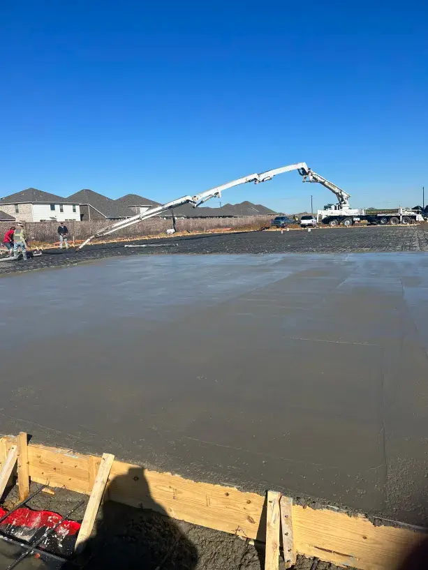 Large residential foundation slab being poured in DFW neighborhood
